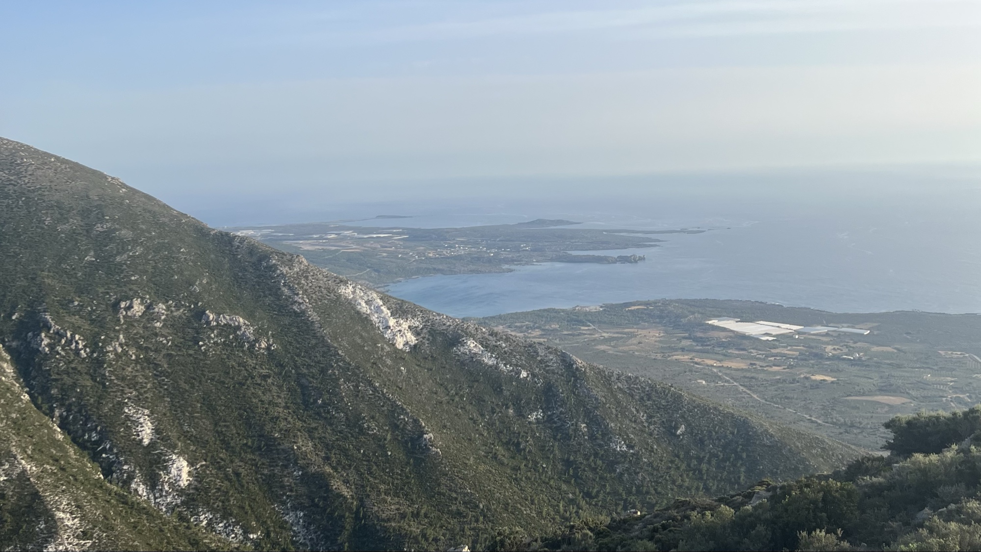 Sheer cliffs meeting turquoise sea on the wild coastline of western Crete