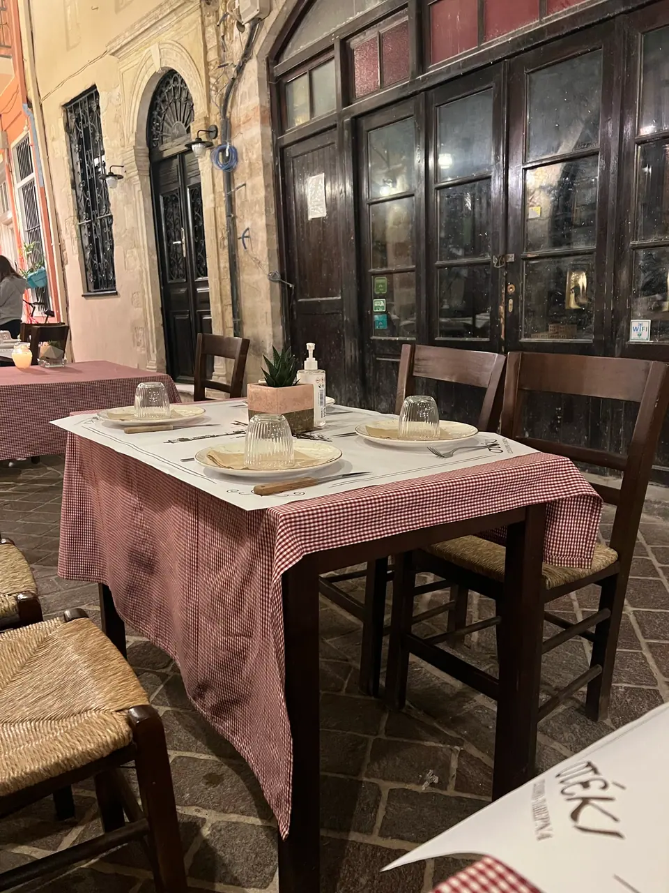 Outdoor taverna dining in Chania Old Town at night